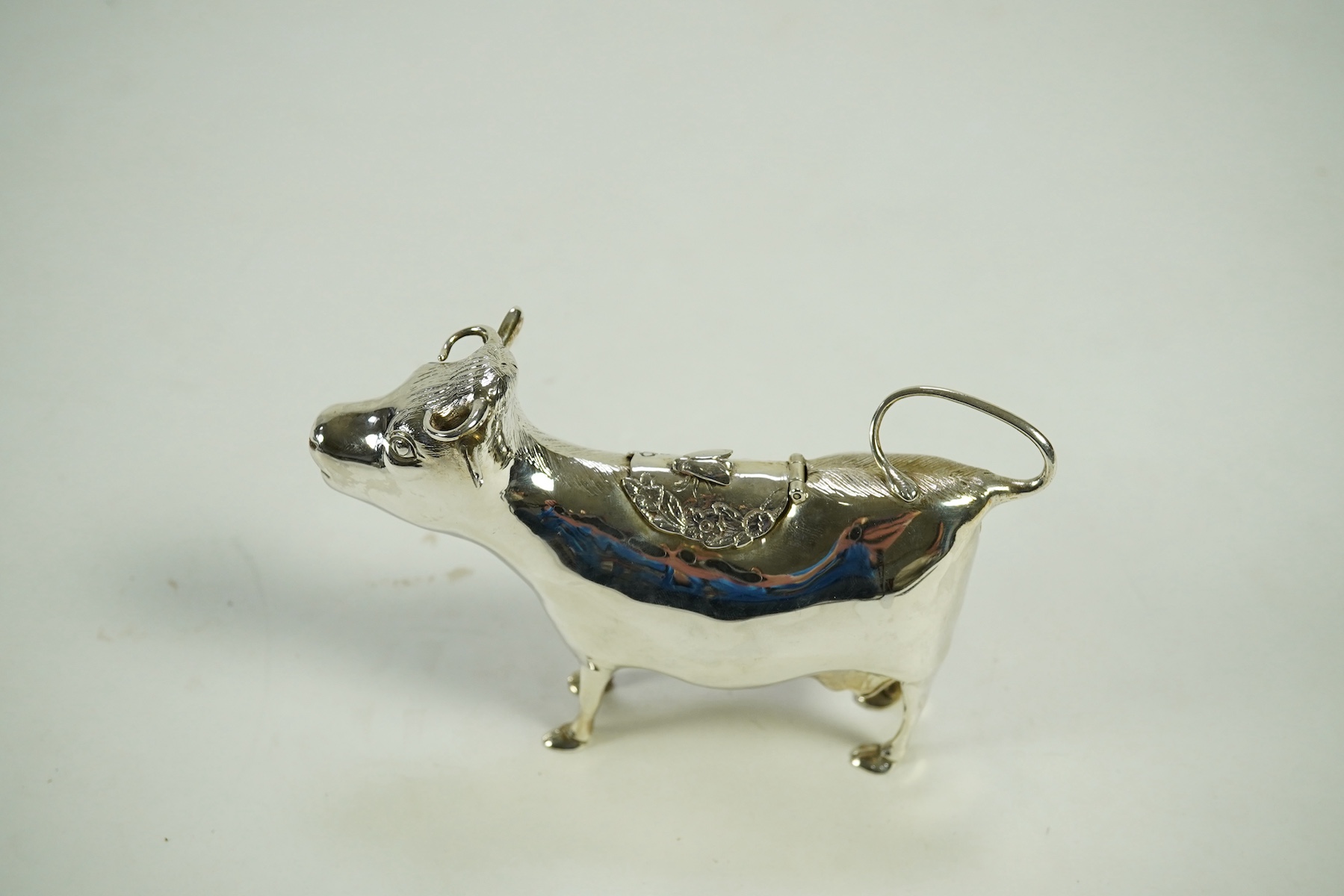 An Elizabeth II silver cow creamer by William Comyns & Sons Ltd